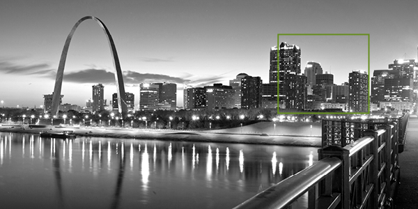 St. Louis skyline at twilight with arch.